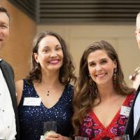 Guests posing in the Grand Gallery at DeVos Place.